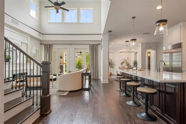 a large kitchen with a table and chairs