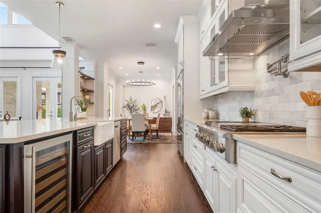 a bedroom with furniture and a large window