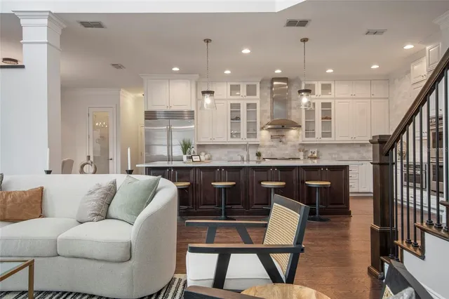 a living room with furniture cabinets and window