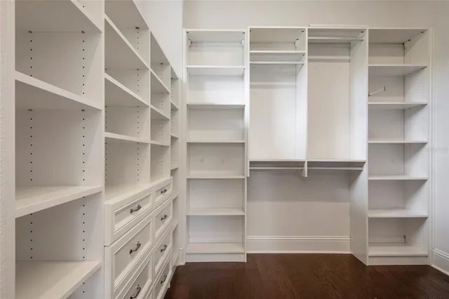 a view of a livingroom with a fireplace and window