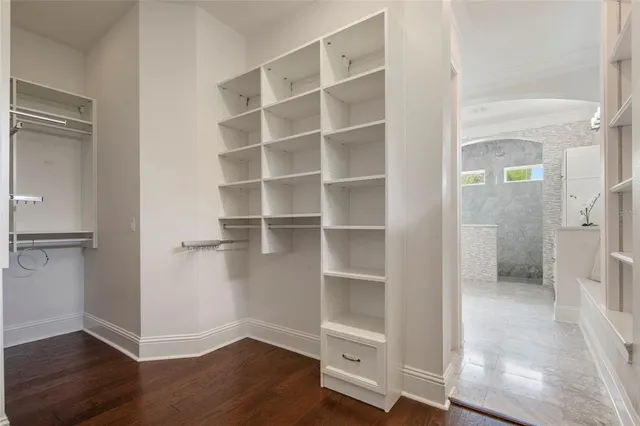 a white building with a yard in front of it