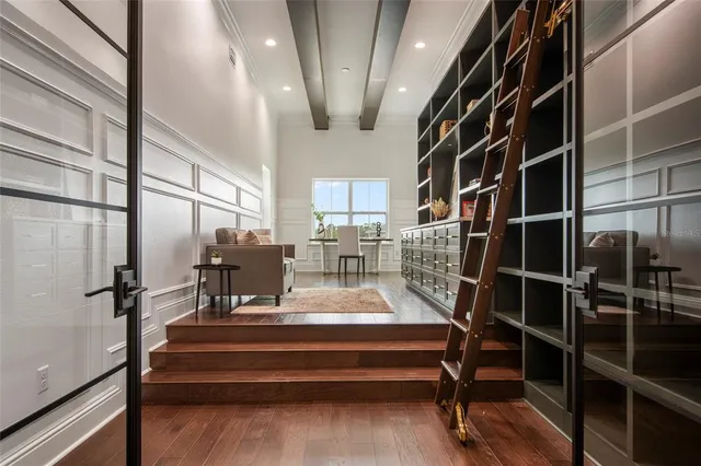 a front view of a building with glass windows and a table