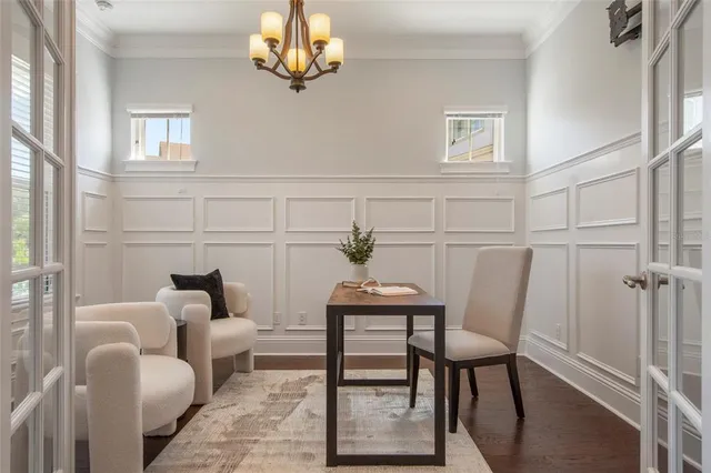 a living room with furniture and a lamp