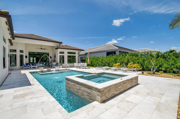 a kitchen with granite countertop kitchen island a counter space and stainless steel appliances