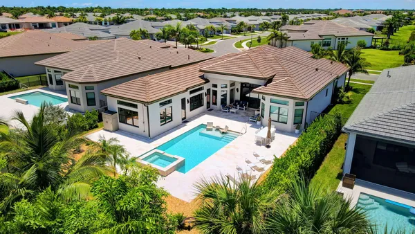 a view of a swimming pool with a yard
