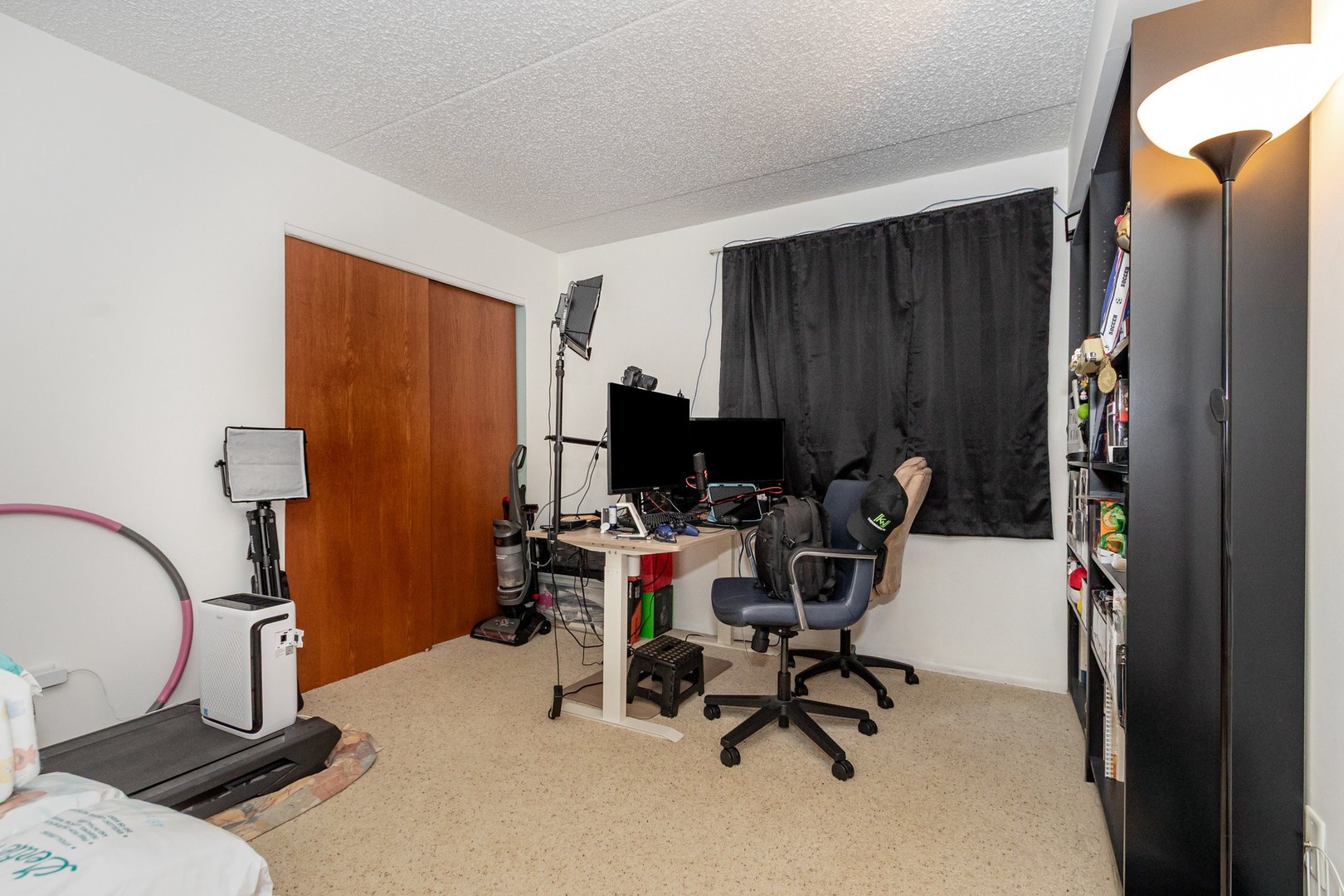 1472 Rock Run Drive, Unit 1B Crest Hill, IL 60403 - Photo 8 of 11 a view of a workspace with furniture and a gate