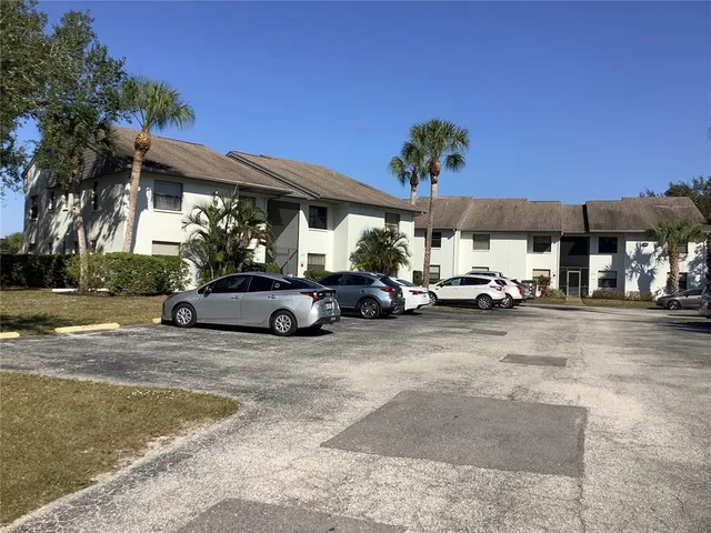 a view of a cars parked in front of a building