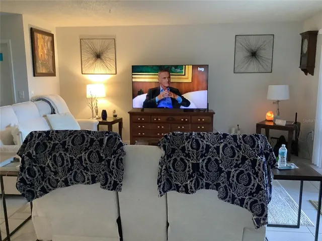 a view of a house with potted plants