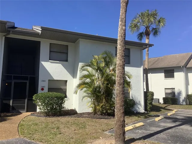 a view of a livingroom with white tiles