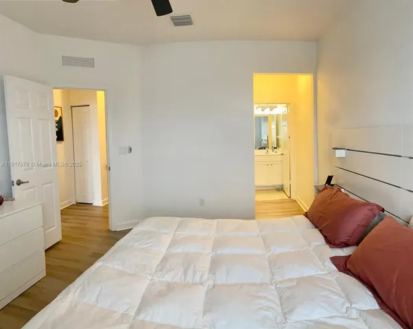 a bedroom with a bed and a tub