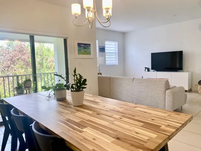 a bedroom with a bed and flat screen tv