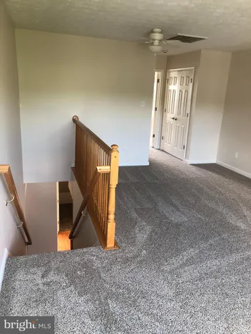 a view of empty room with windows