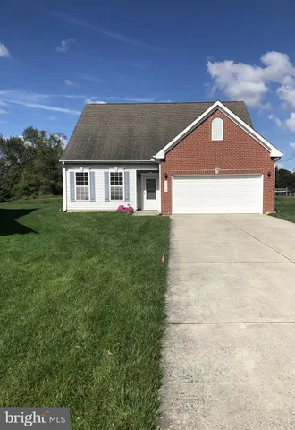 a front view of a house with yard
