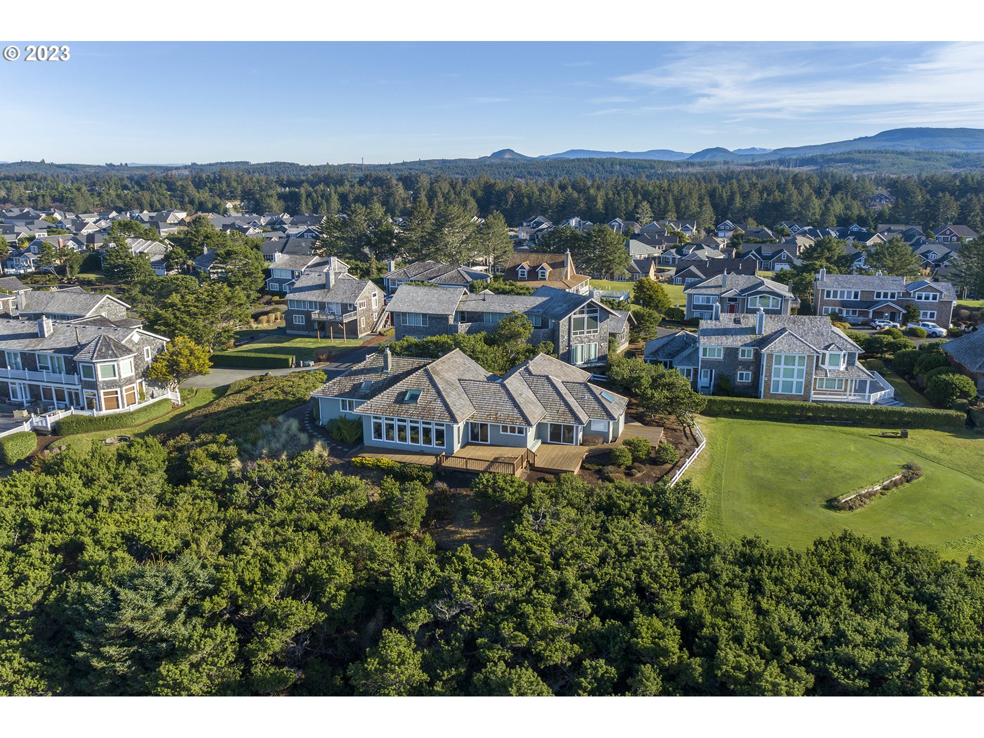 4750 High Ridge Road Gearhart, OR 97138 - Photo 7 of 28 a view of a city with mountains in the background