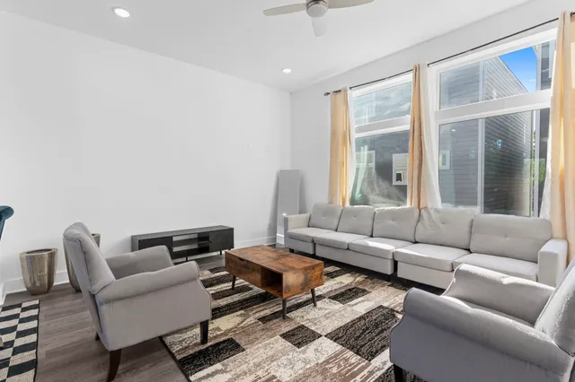 a living room with furniture and a window