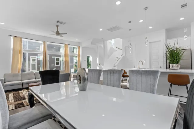 a view of a dining room with furniture and window