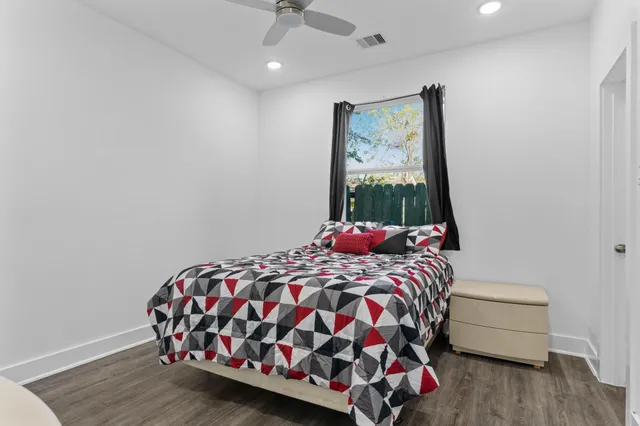 a view of a room with wooden floor and staircase