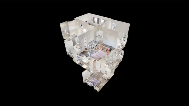 an aerial view of a house with a yard