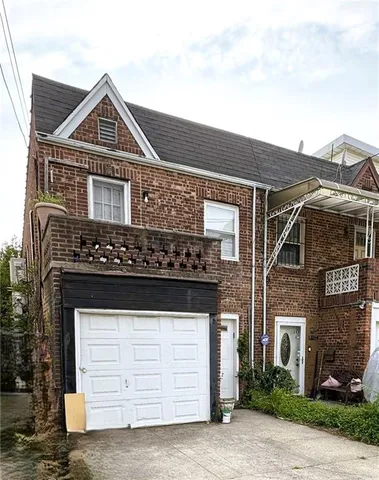 a front view of a house with a garage