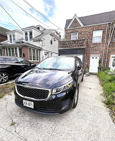 a view of a house with a wooden fence