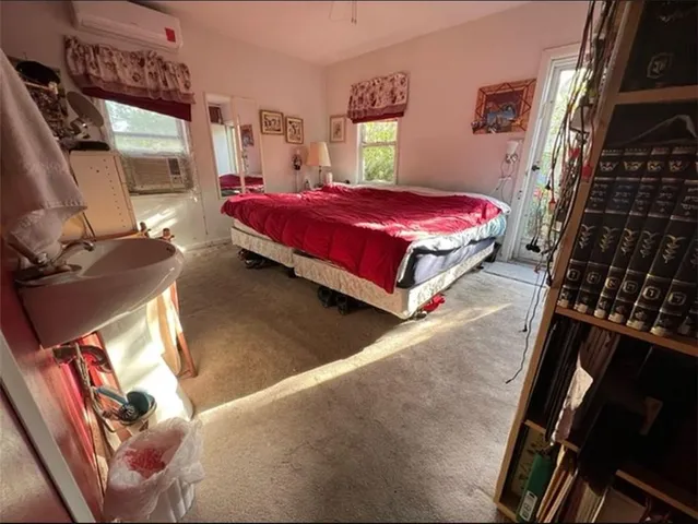 a bed room with a bed and a window