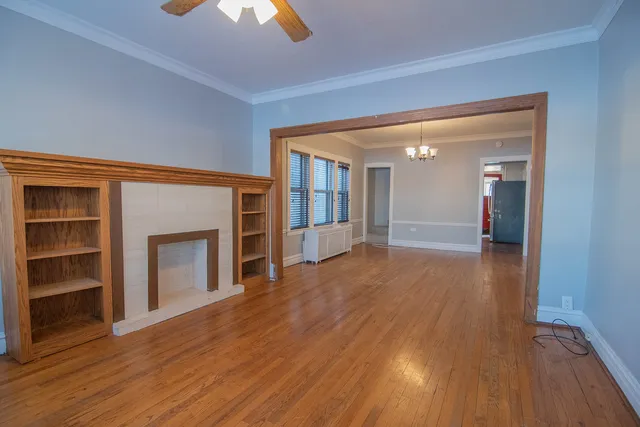 a kitchen with granite countertop wooden cabinets a stove and a sink
