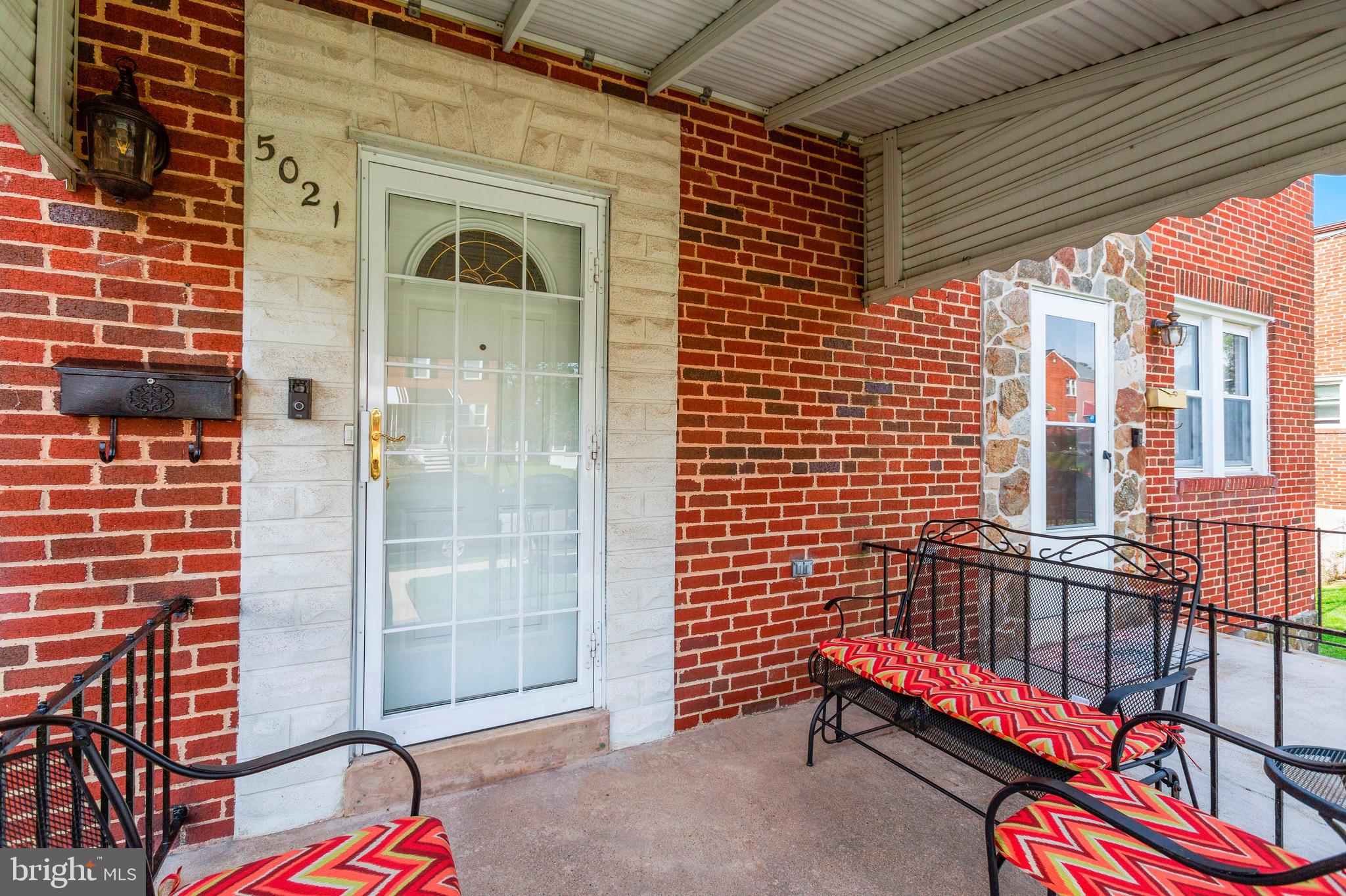 5021 West Hills Road Baltimore, MD 21229 - Photo 3 of 25 a front view of a house with a door