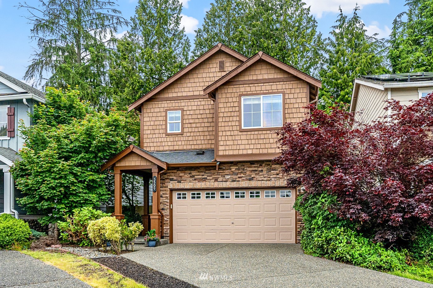 3509 160th Place Southeast Bothell, WA 98012 - Photo 1 of 31 a front view of a house with a garden