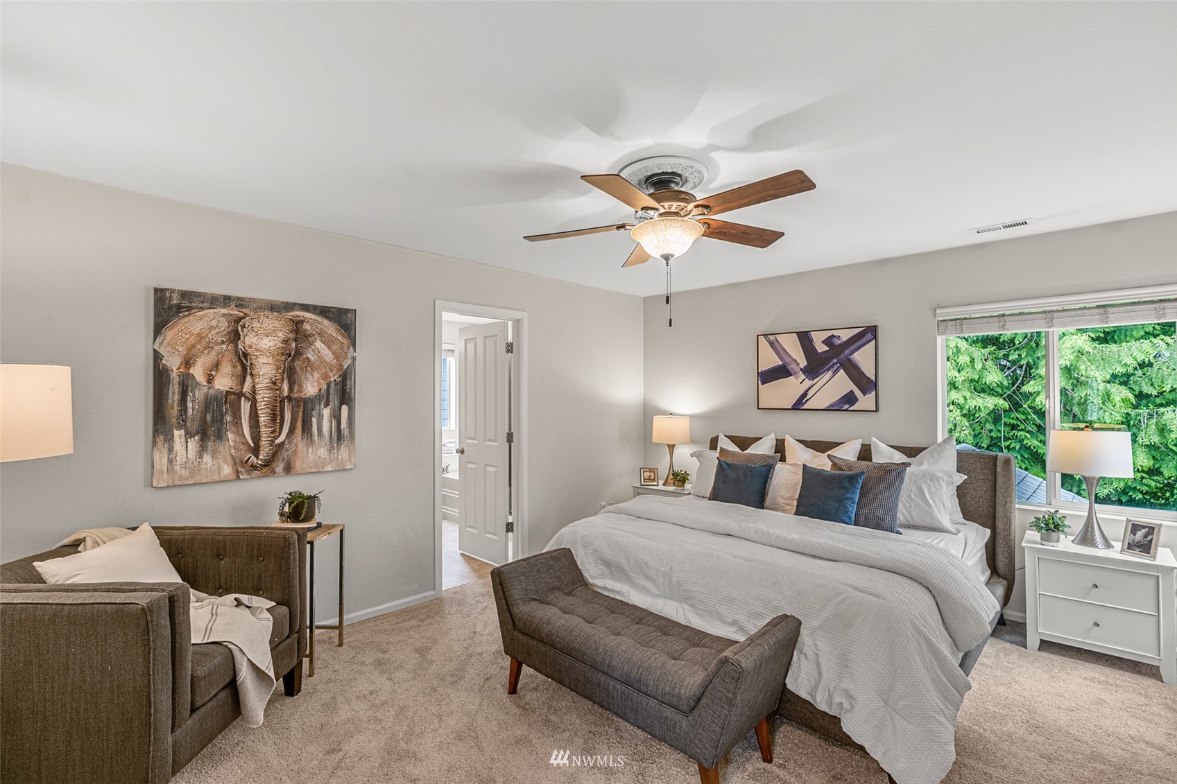 3509 160th Place Southeast Bothell, WA 98012 - Photo 15 of 31 a bedroom with a bed and a chandelier