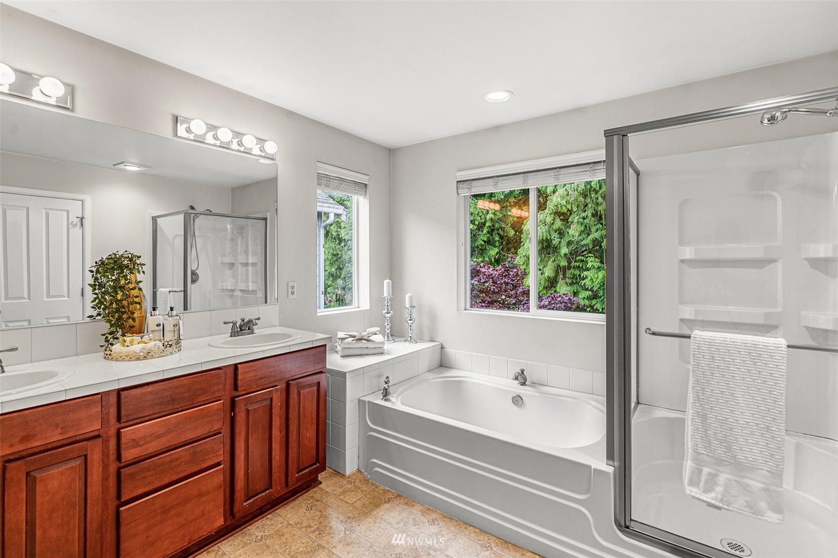 3509 160th Place Southeast Bothell, WA 98012 - Photo 18 of 31 a bathroom with a tub a sink and a large mirror