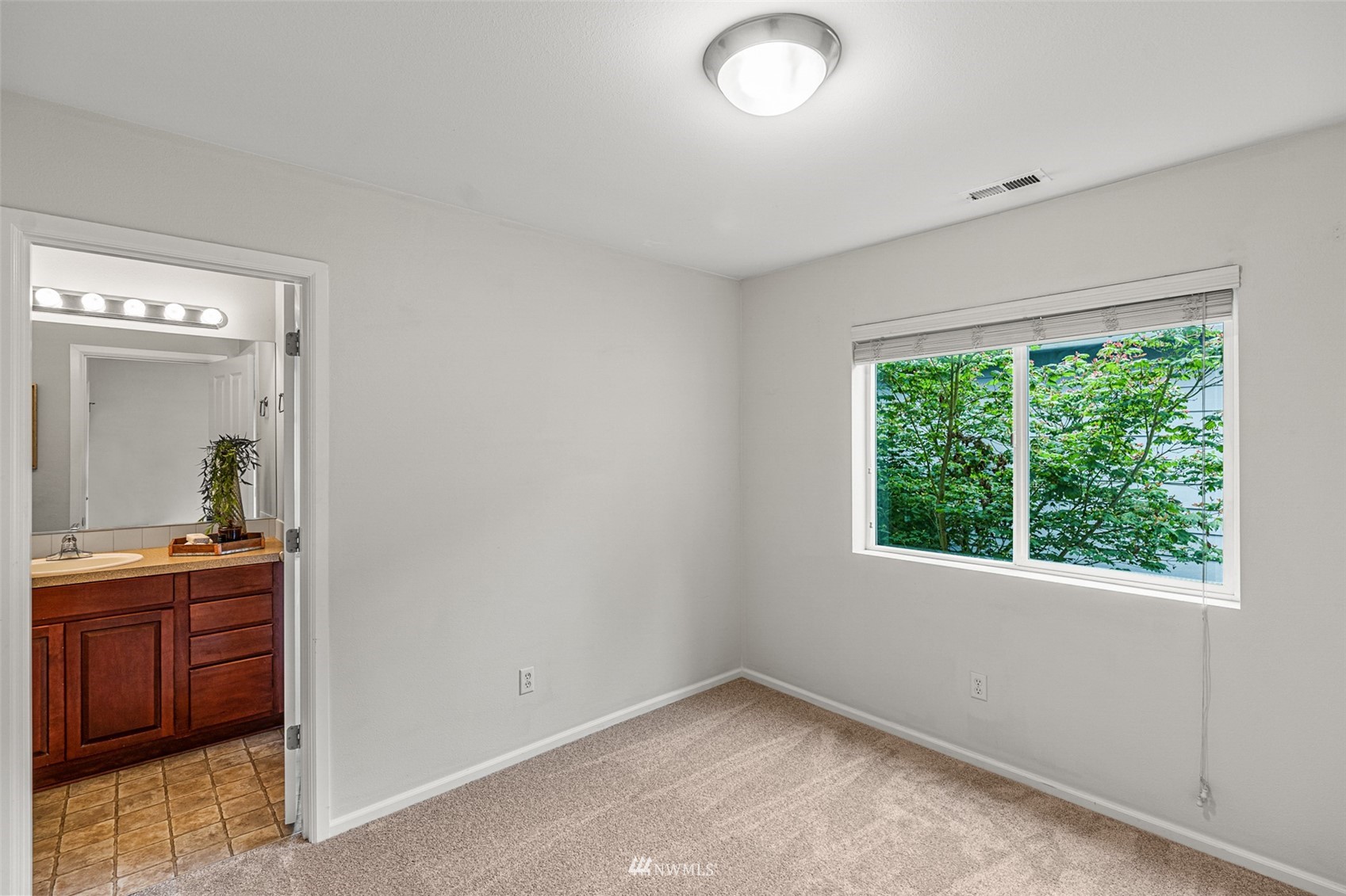 3509 160th Place Southeast Bothell, WA 98012 - Photo 22 of 31 a view of a room that has a bed and a dresser in it