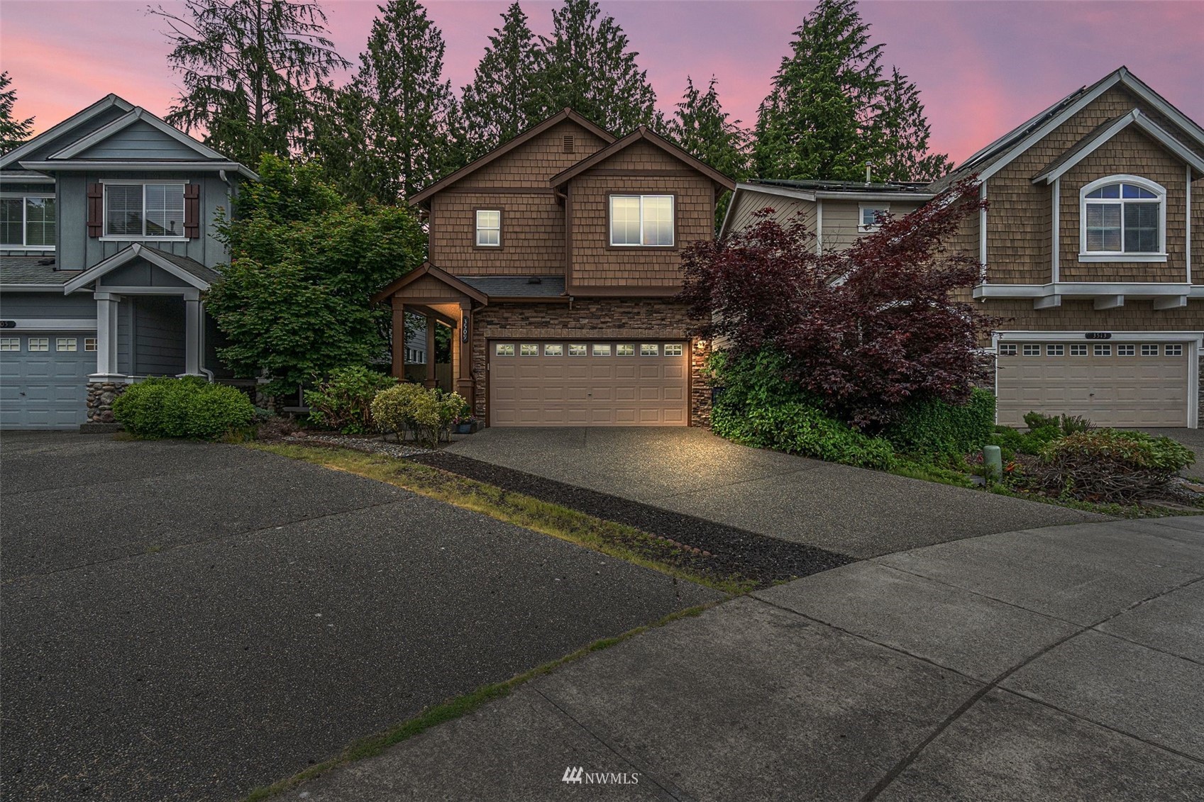 3509 160th Place Southeast Bothell, WA 98012 - Photo 31 of 31 a front view of a house with a yard and garage