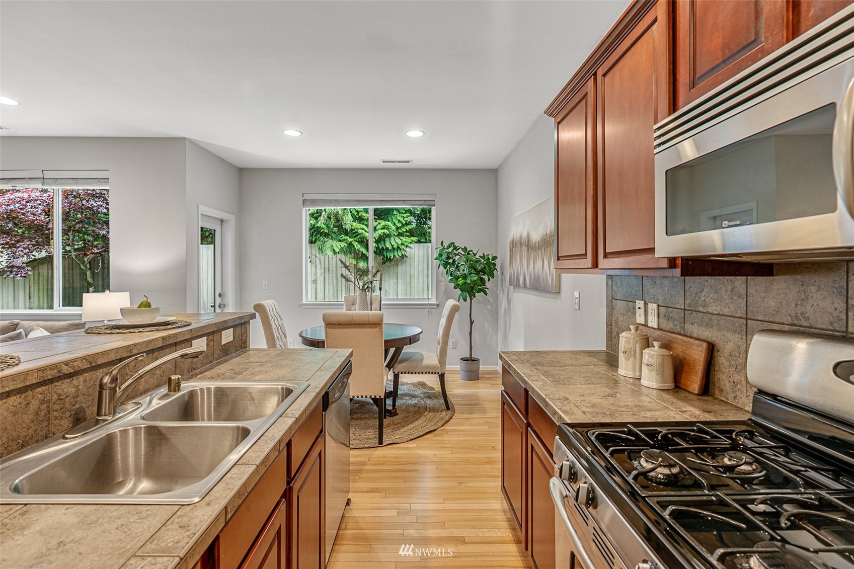 3509 160th Place Southeast Bothell, WA 98012 - Photo 6 of 31 a kitchen with a stove and a sink