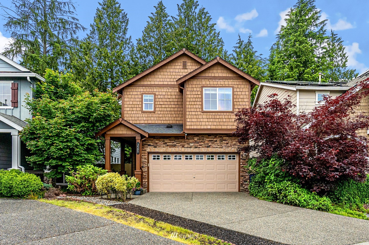 3509 160th Place Southeast Bothell, WA 98012 - Photo 10 of 31 a front view of a house with a garden and plants