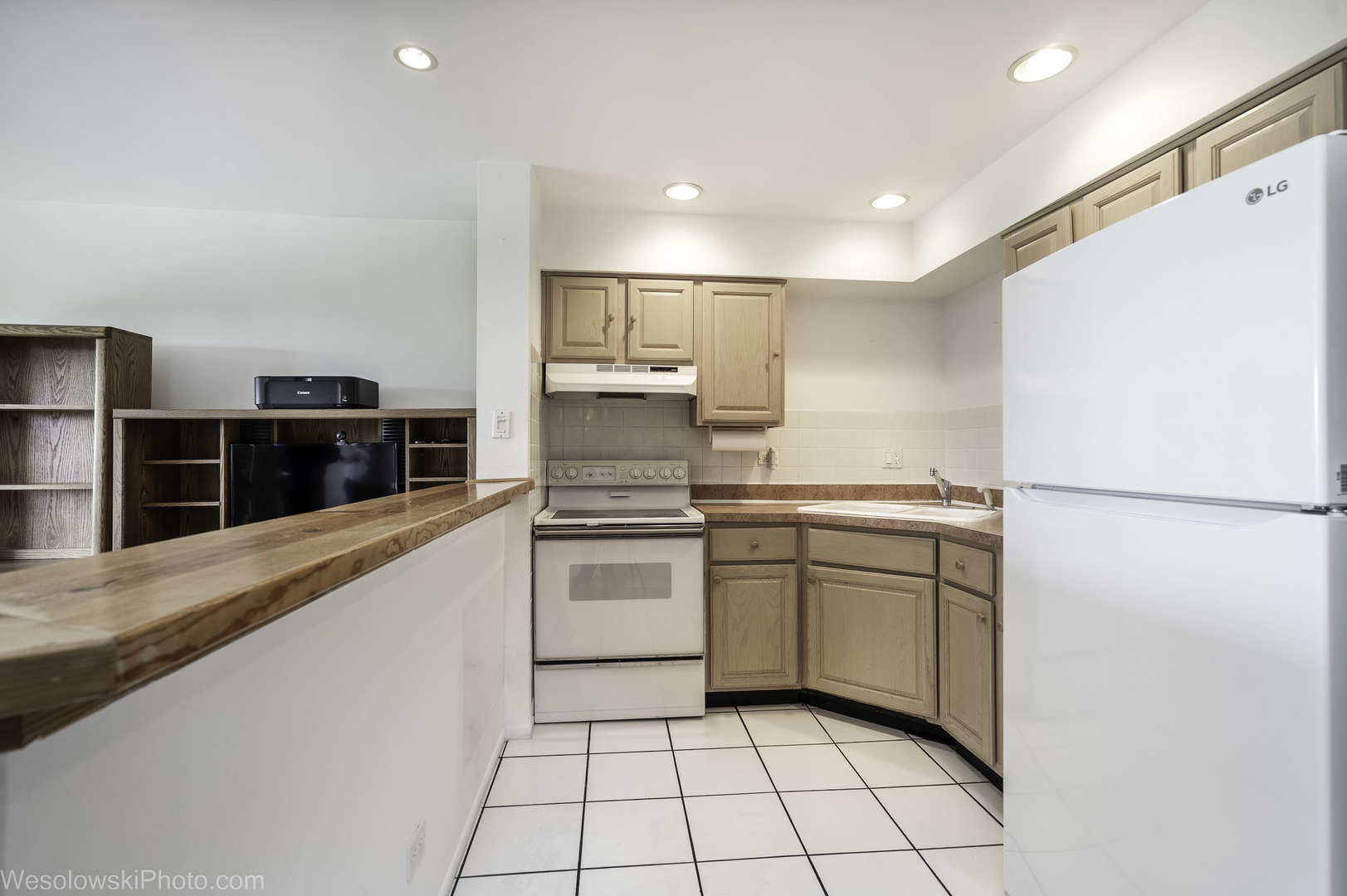 8359 West Addison Street, Unit 503 Chicago, IL 60634 - Photo 11 of 19 a kitchen with white cabinets and white appliances