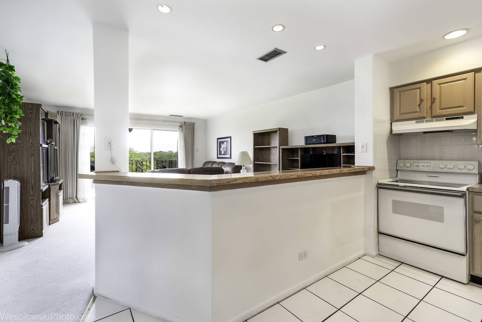 8359 West Addison Street, Unit 503 Chicago, IL 60634 - Photo 12 of 19 a kitchen with stainless steel appliances a refrigerator sink and stove