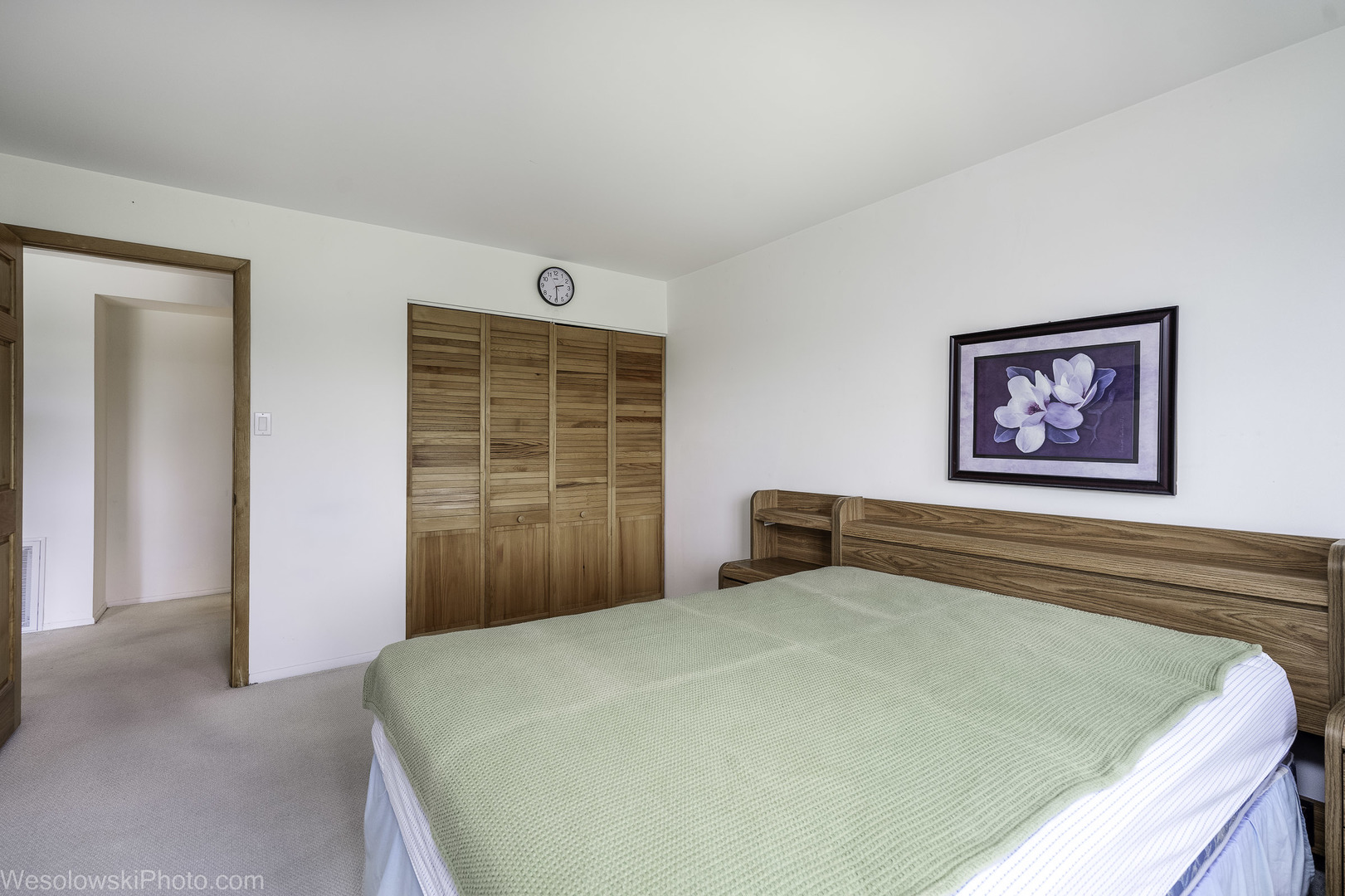 8359 West Addison Street, Unit 503 Chicago, IL 60634 - Photo 13 of 19 a bedroom with a bed and a window