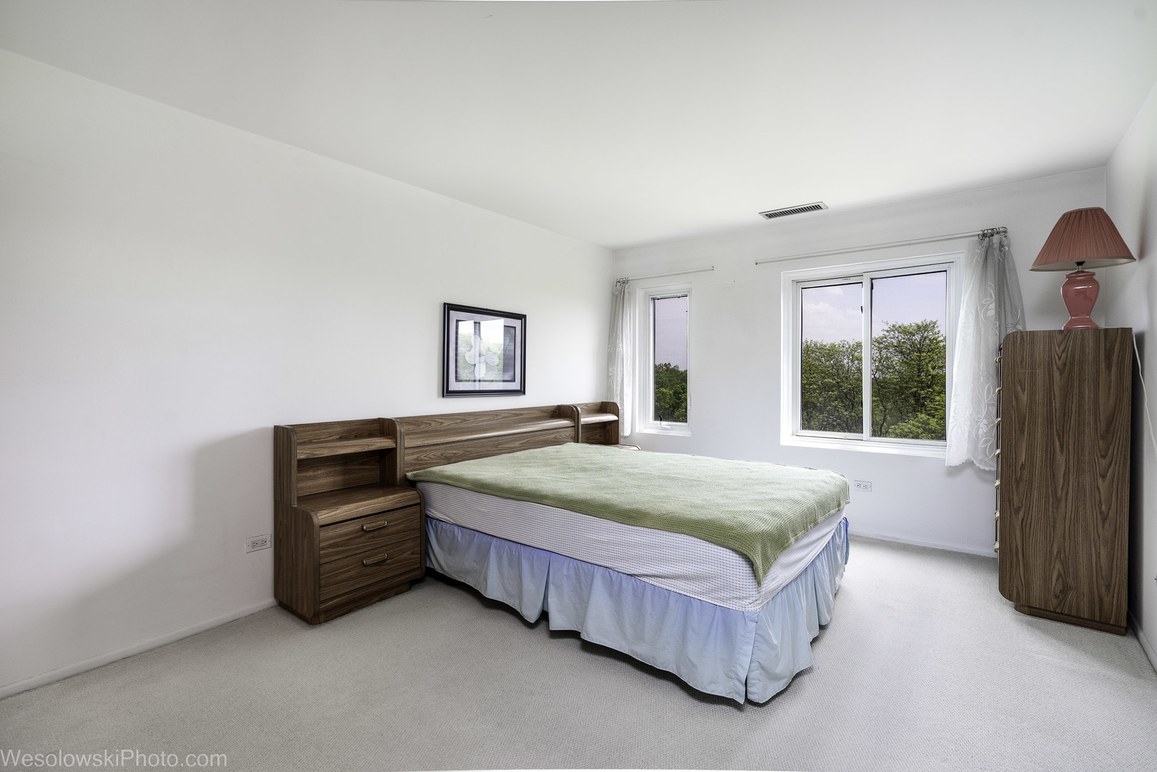 8359 West Addison Street, Unit 503 Chicago, IL 60634 - Photo 14 of 19 a spacious bedroom with a bed and window