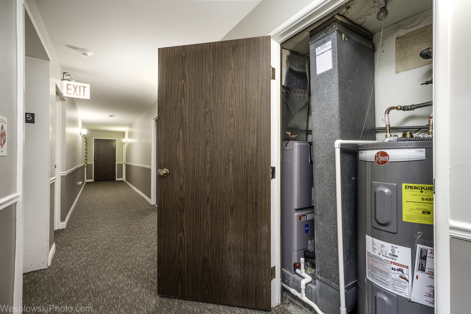 8359 West Addison Street, Unit 503 Chicago, IL 60634 - Photo 17 of 19 a view of hallway with wooden floor and front door