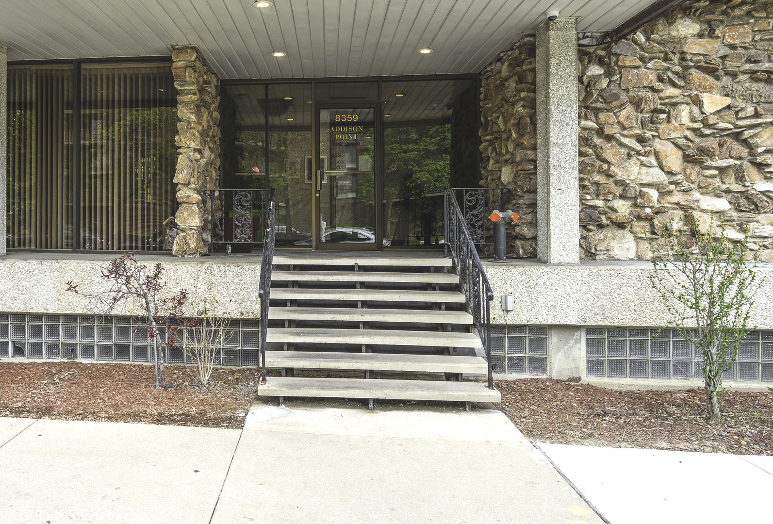 8359 West Addison Street, Unit 503 Chicago, IL 60634 - Photo 2 of 19 a front view of a house with a porch