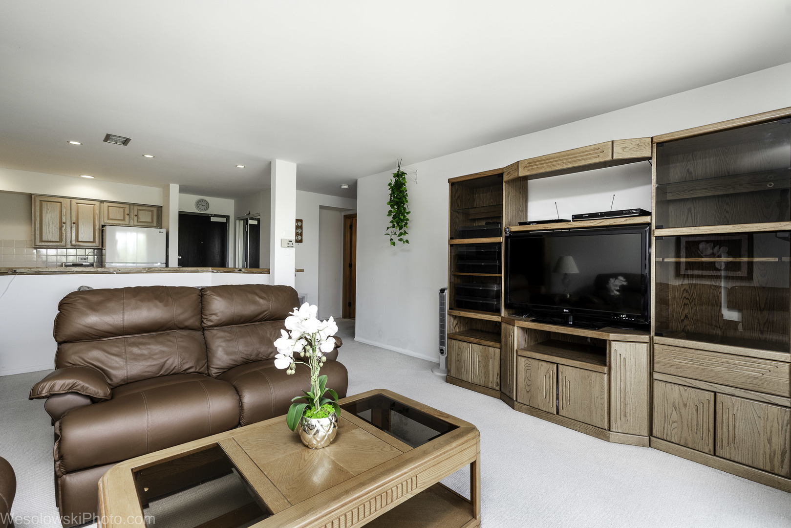 8359 West Addison Street, Unit 503 Chicago, IL 60634 - Photo 4 of 19 a living room with furniture and a flat screen tv