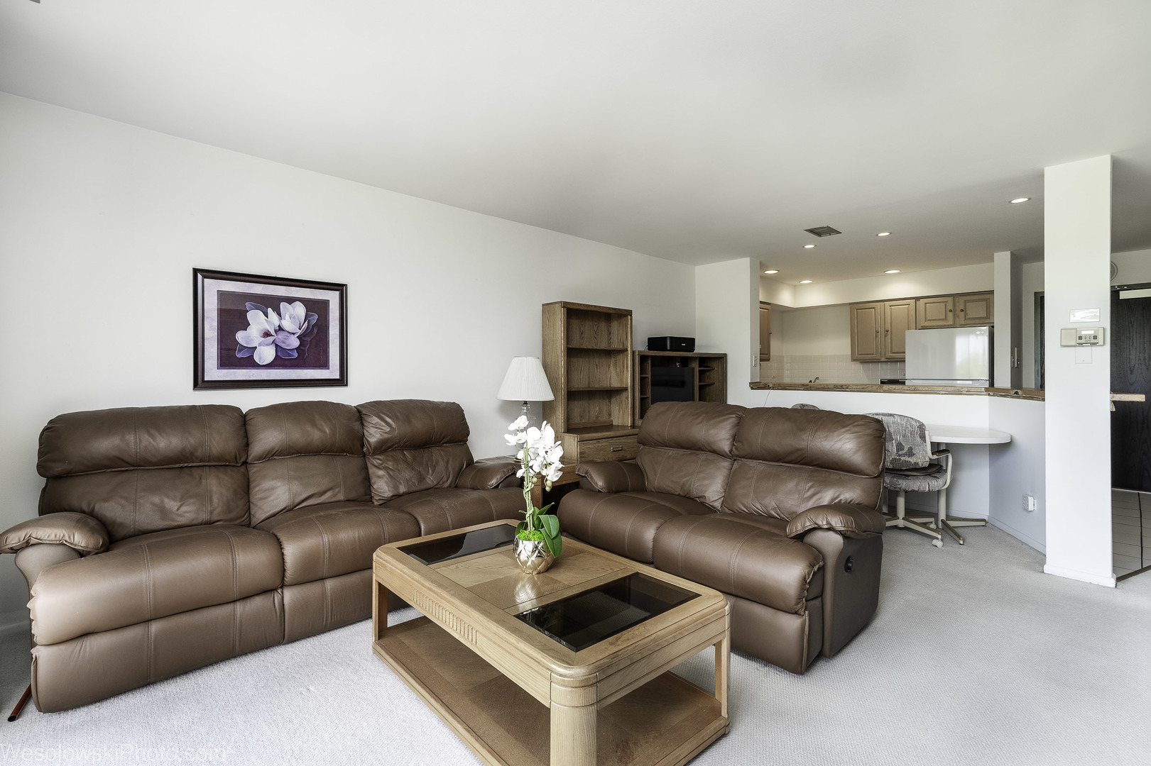 8359 West Addison Street, Unit 503 Chicago, IL 60634 - Photo 5 of 19 a living room with furniture and a view of kitchen