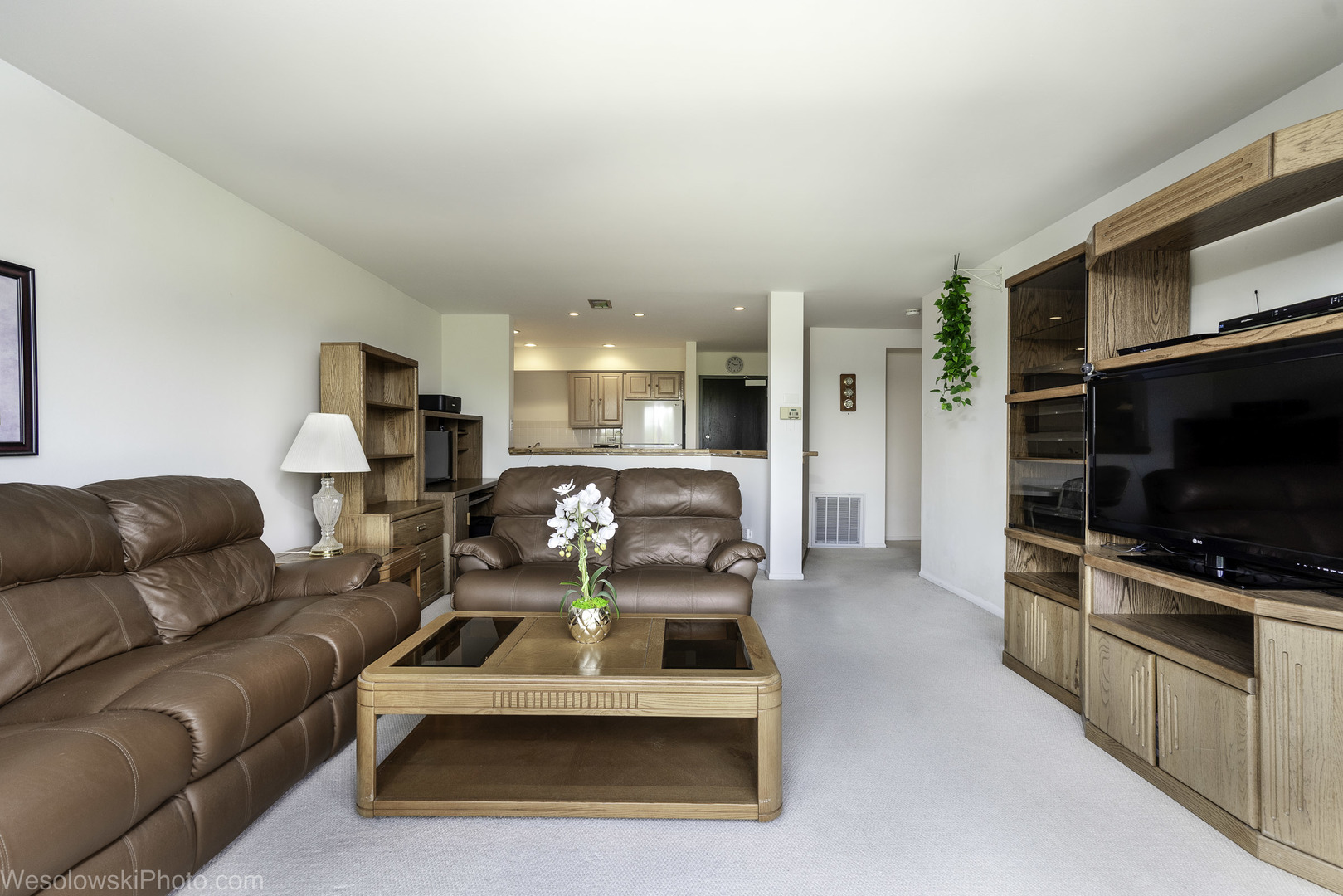 8359 West Addison Street, Unit 503 Chicago, IL 60634 - Photo 6 of 19 a living room with furniture and a flat screen tv
