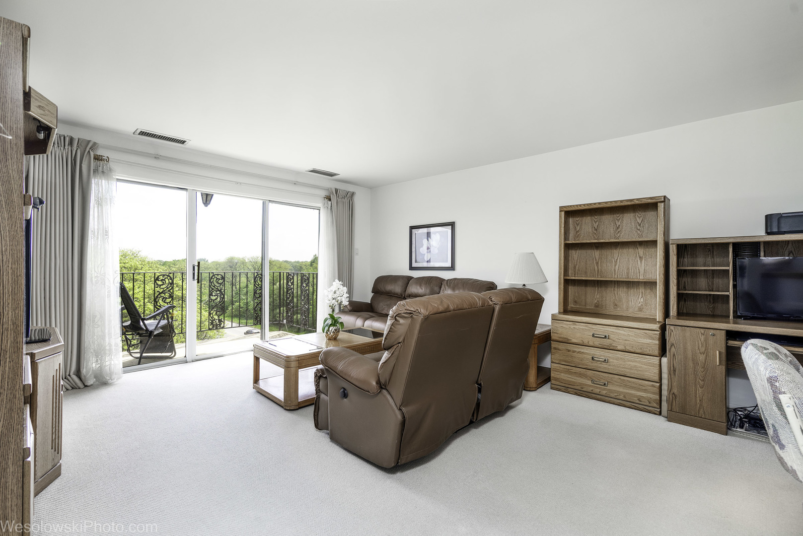 8359 West Addison Street, Unit 503 Chicago, IL 60634 - Photo 7 of 19 a living room with furniture and a flat screen tv