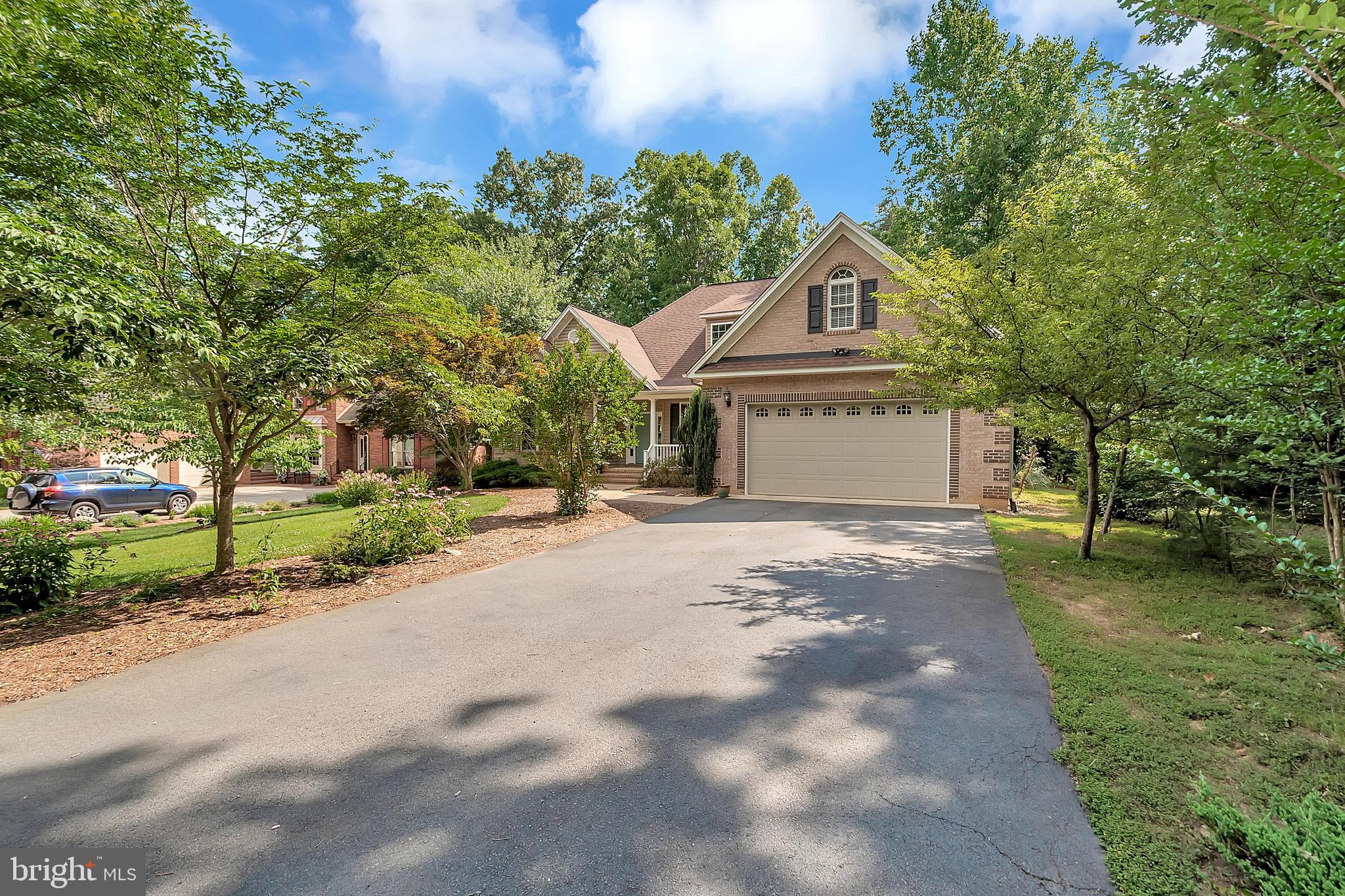 102 Birdie Road Locust Grove, VA 22508 - Photo 2 of 35 a house with a tree in front of it