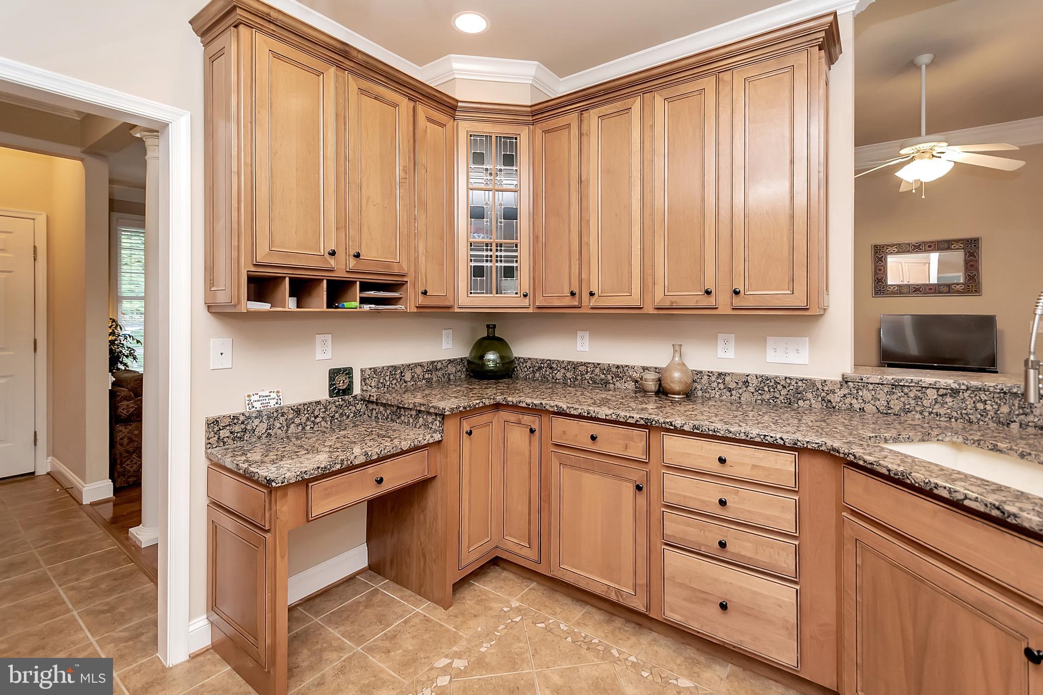 102 Birdie Road Locust Grove, VA 22508 - Photo 15 of 35 a kitchen with stainless steel appliances granite countertop a stove a sink and a microwave