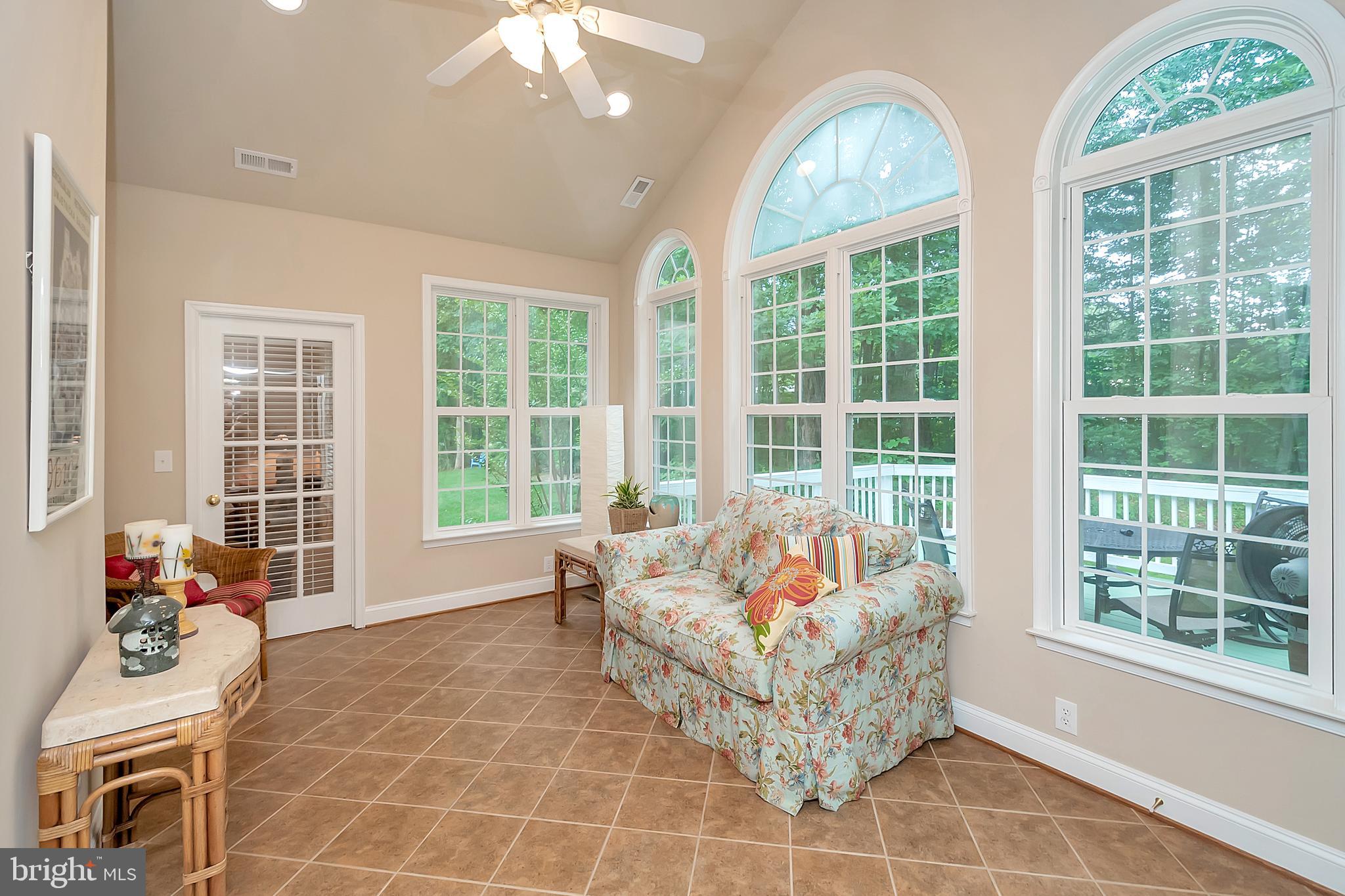 102 Birdie Road Locust Grove, VA 22508 - Photo 18 of 35 a living room with furniture and floor to ceiling windows