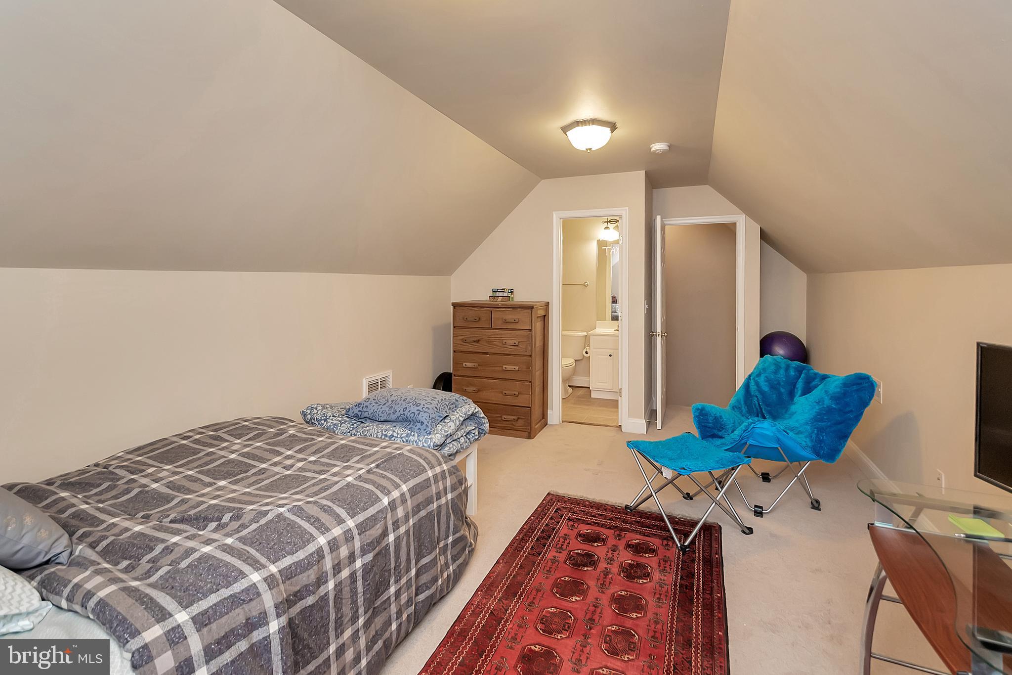 102 Birdie Road Locust Grove, VA 22508 - Photo 21 of 35 a bedroom with a bed and wooden floor