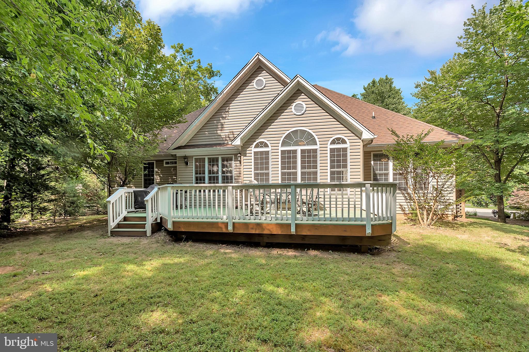 102 Birdie Road Locust Grove, VA 22508 - Photo 27 of 35 a view of a house with a yard and deck