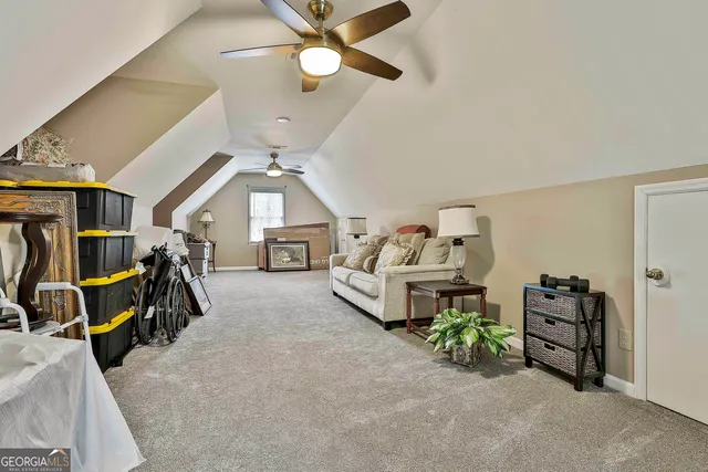 a bedroom with furniture and a chandelier